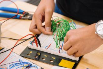 Technician working on electronics components