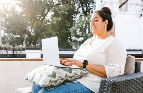 student studying on balcony