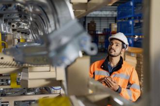 Technician checking the welding on the production line