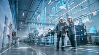 Two industrial engineers visualize factory digitalization