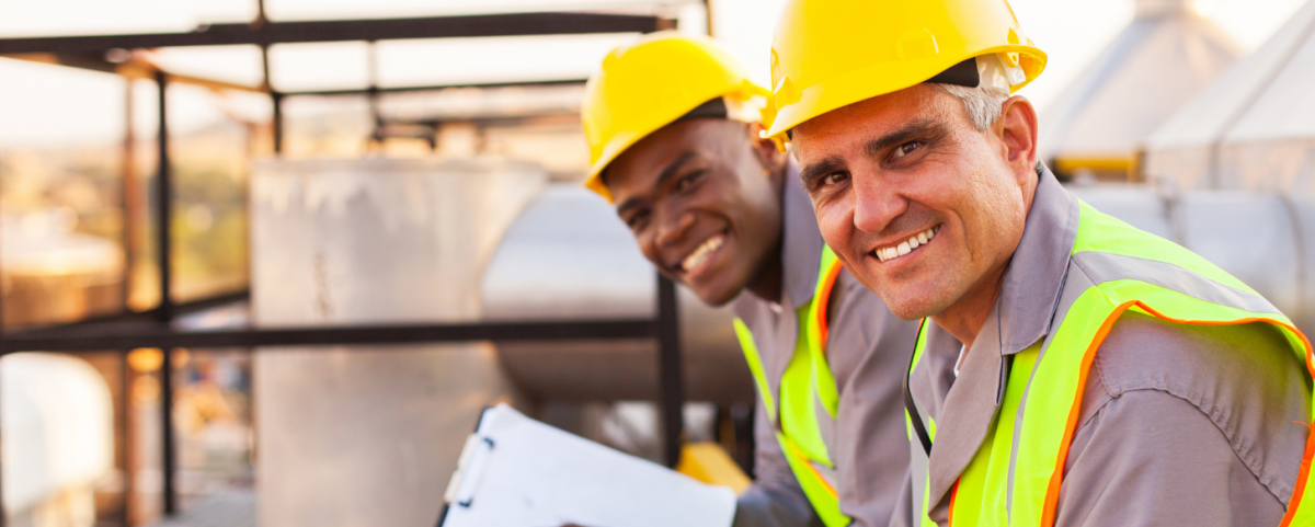 two technicians smiling