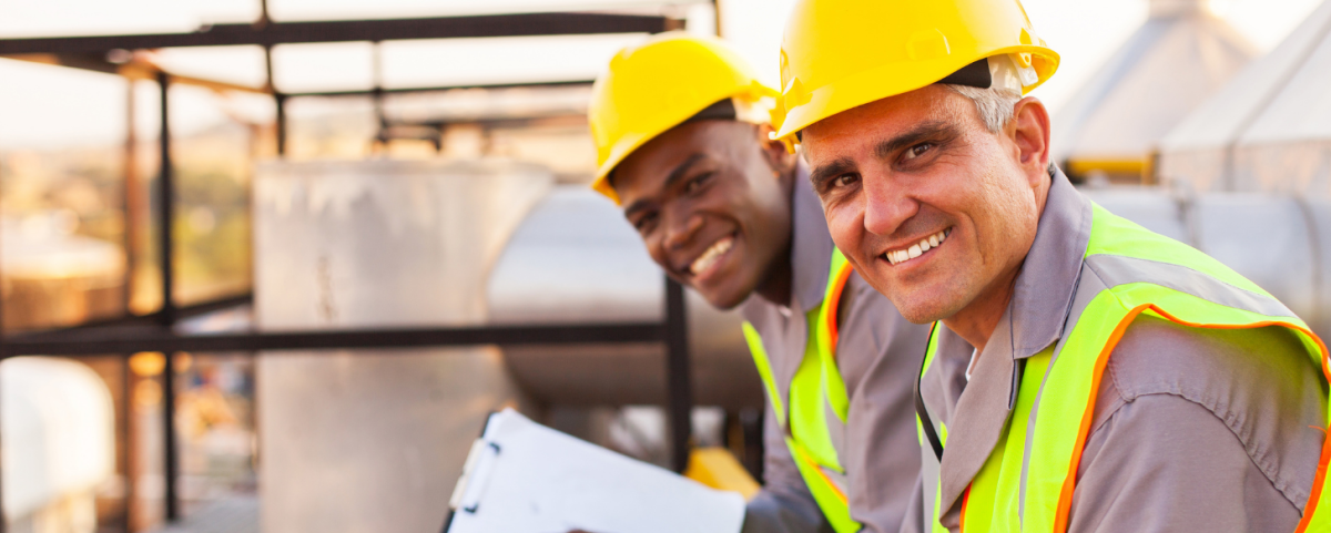 two technicians smiling 