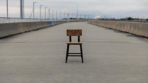 Chair on road by Andrew Shelley