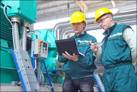 Manager and Technician working with PLC