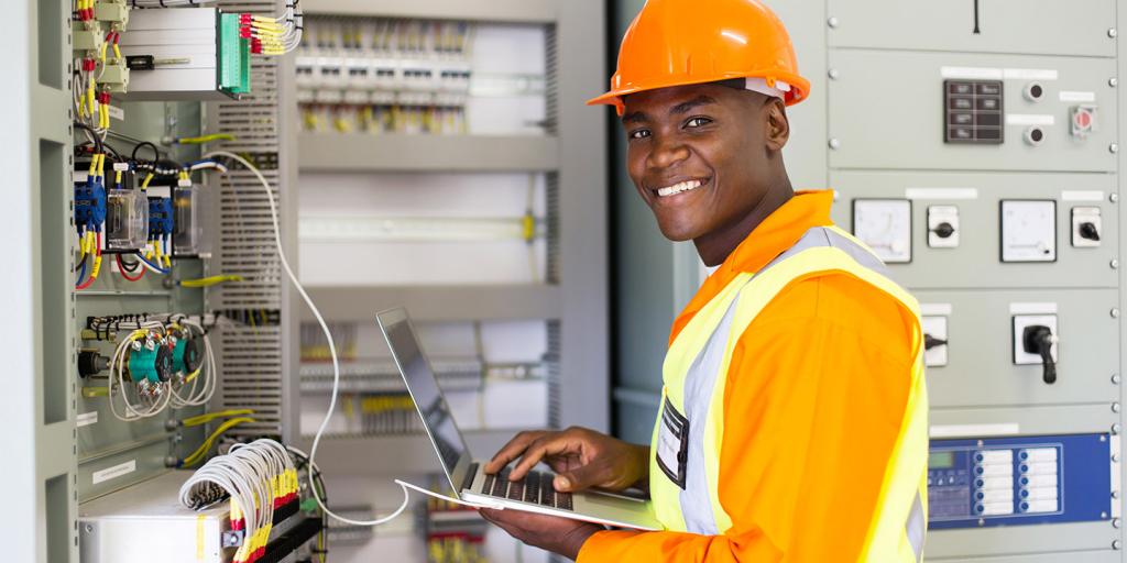 Technician checking a control panel